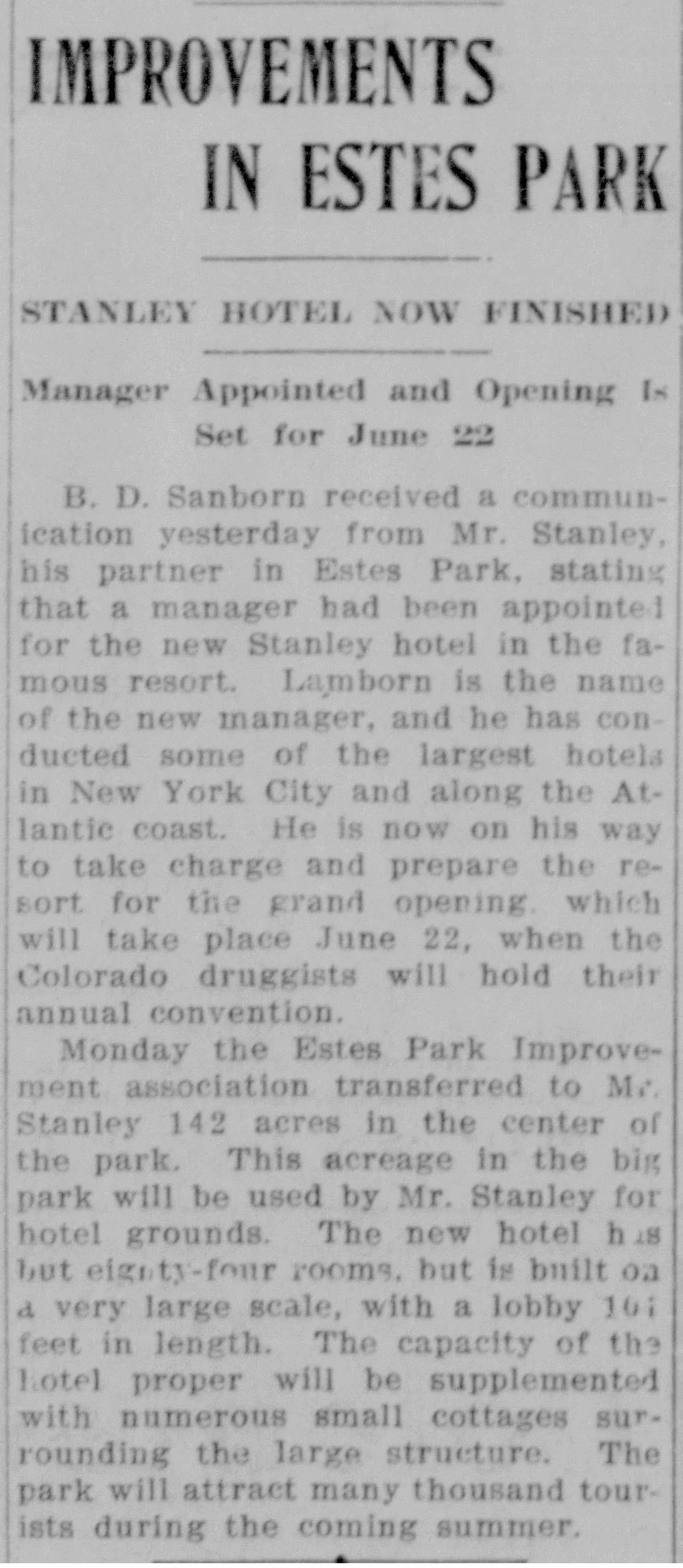 Newspaper clipping headlined "Improvements in Estes Park / Stanley Hotel Now Finished," announcing the grand opening of the Stanley Hotel in Estes Park, Colorado, set for June 22, 1909, with details on the manager, room count, and lobby dimensions.