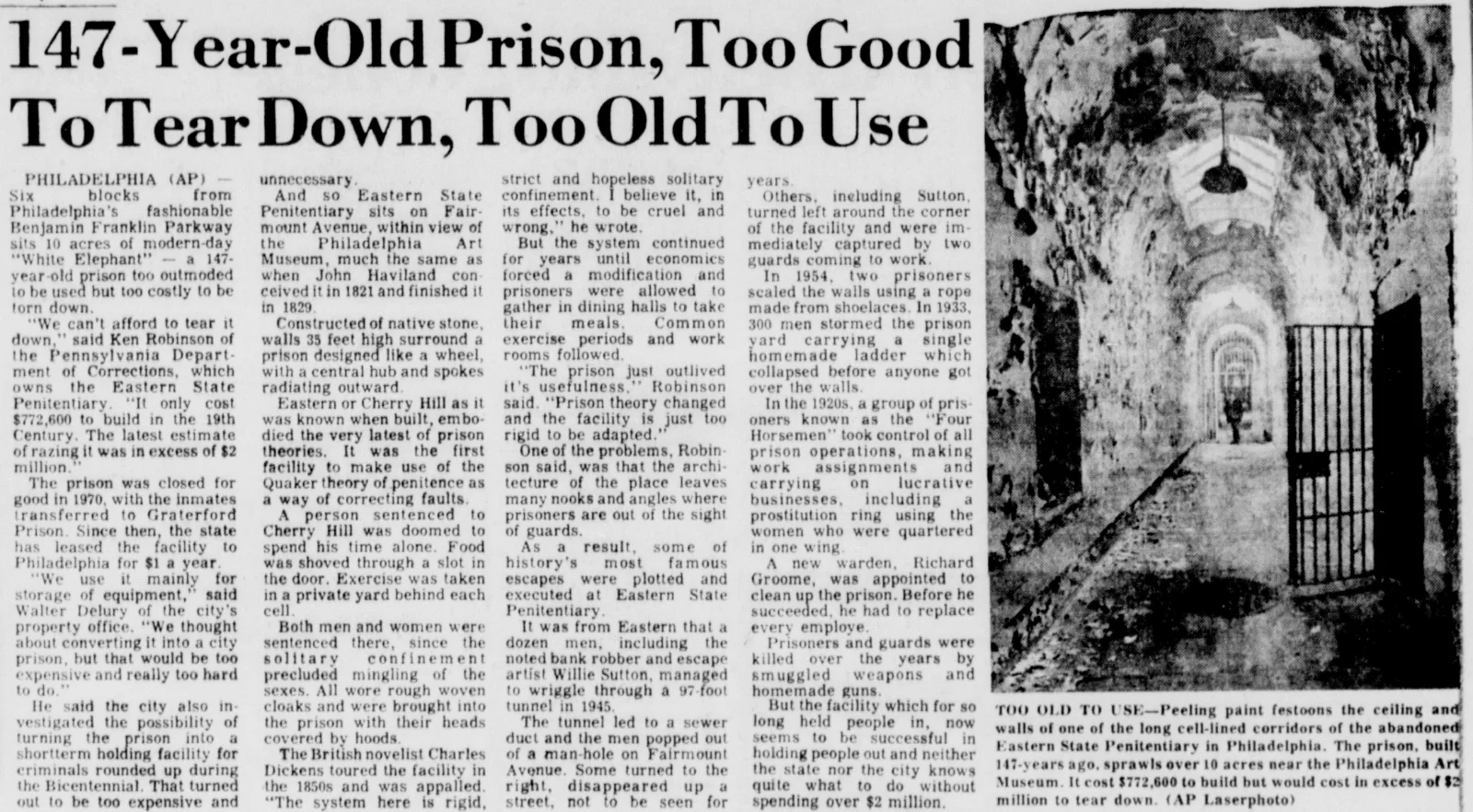 Newspaper article from 1977 headlined "147-Year-Old Prison, Too Good to Tear Down, Too Old to Use," with a photograph of a long, peeling cell corridor at the abandoned Eastern State Penitentiary in Philadelphia.